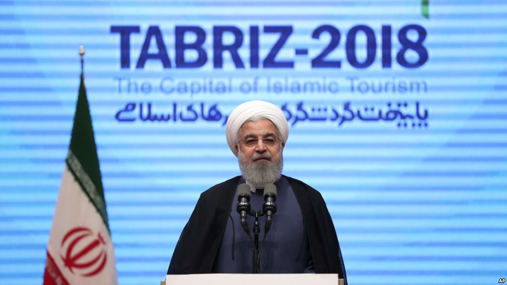 In this photo released by official website of the office of the Iranian Presidency, President Hassan Rouhani speaks during a conference in the northwestern city of Tabriz, Iran, Wednesday, April 25, 2018. (Iranian Presidency Office via AP)