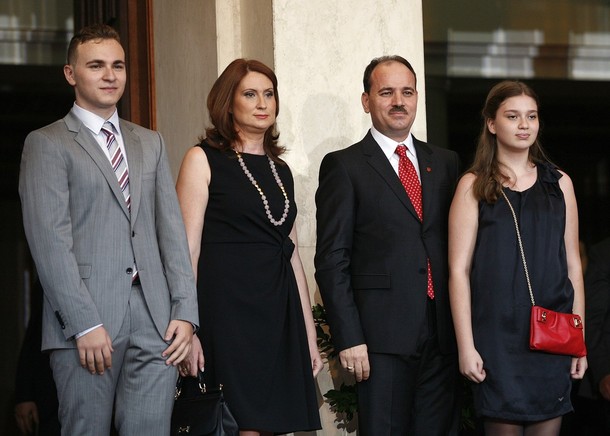 Albania's new President Bujar Nishani stands with his wife Odeta and his daughter, Fiona (R) and his son Ilir (L) during a ceremony in Tirana July 24, 2012. Nishani called for political unity in the country in order to meet the "historic challenge" of European Union membership. REUTERS/Arben Celi (ALBANIA - Tags: POLITICS)