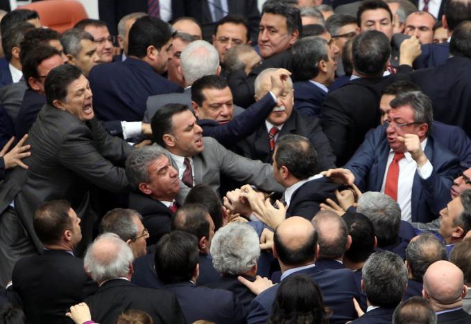 Lawmakers from ruling AK Party and the main opposition Republican People's Party scuffle during a debate on the proposed constitutional changes at the Turkish Parliament in Ankara