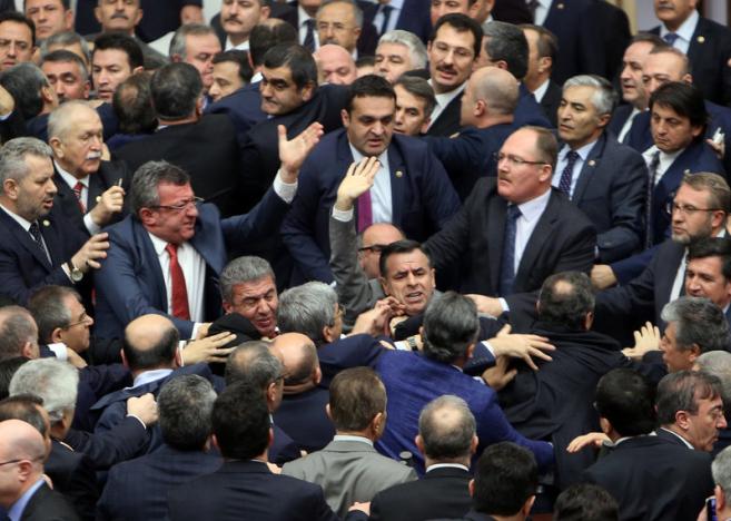 Lawmakers from ruling AK Party and the main opposition Republican People's Party scuffle during a debate on the proposed constitutional changes at the Turkish Parliament in Ankara