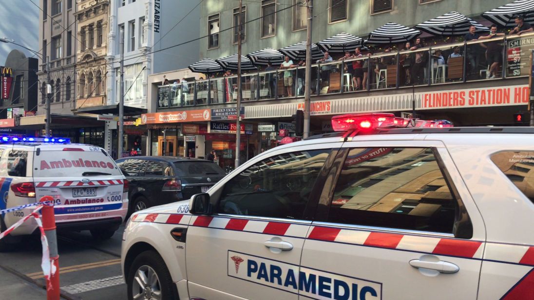 Police and emergency services attend the scene of an incident involving a vehicle on Flinders Street, as seen from Swanson Street, in Melbourne, Australia December 21, 2017. AAP/Kaitlyn Offer via REUTERS ATTENTION EDITORS - THIS IMAGE WAS PROVIDED BY A THIRD PARTY. NO RESALES. NO ARCHIVE. AUSTRALIA OUT. NEW ZEALAND OUT.?