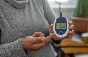 Woman checking her glucose level