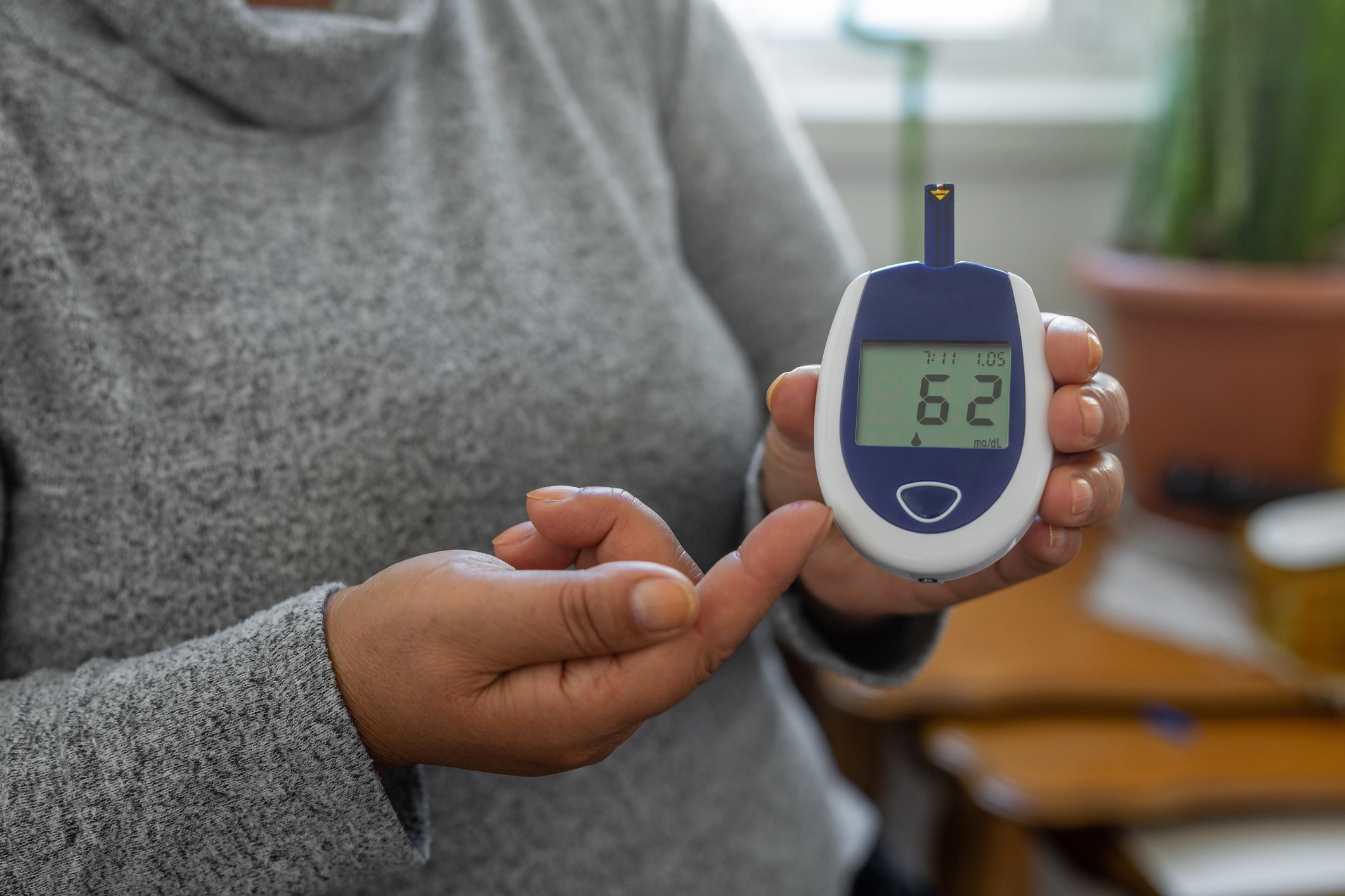 Woman checking her glucose level