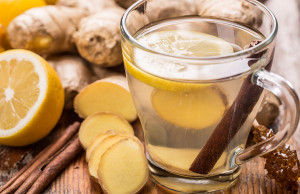 Ginger and lemon tea in glass cup