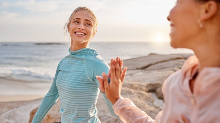 Fitness,,Touching,Hands,And,Couple,Of,Friends,At,The,Beach